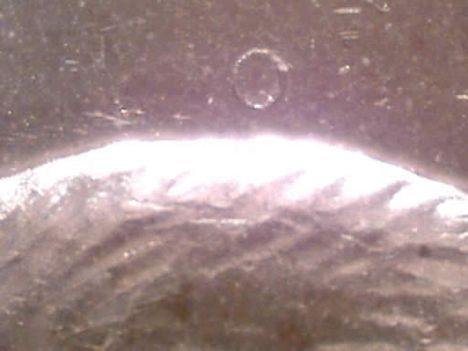 Raised-Circle-In-The-Field-Of-A-Nickle